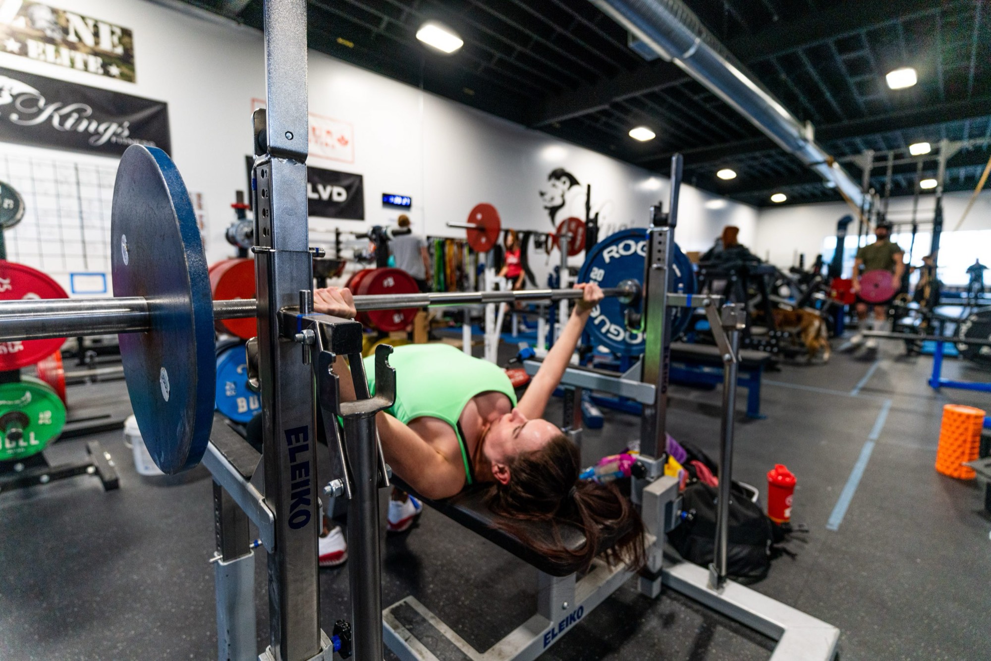 A member benches on an Eleiko competition rack at Kings Fitness