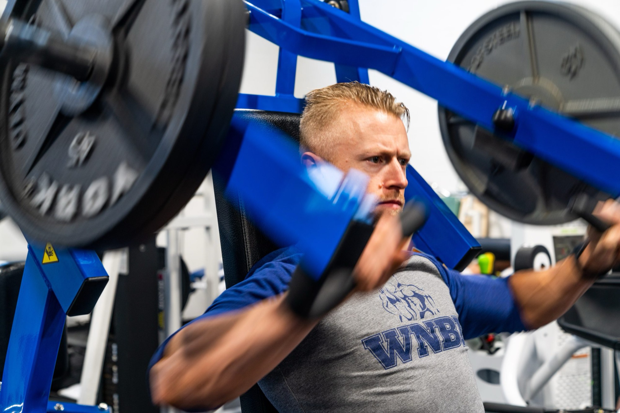 Pressing on a royal blue Atlantis machine